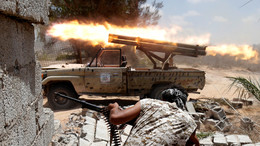 Хроника пикирующей Ливии: вся история конфликта — в цифрах, фактах и фотографиях